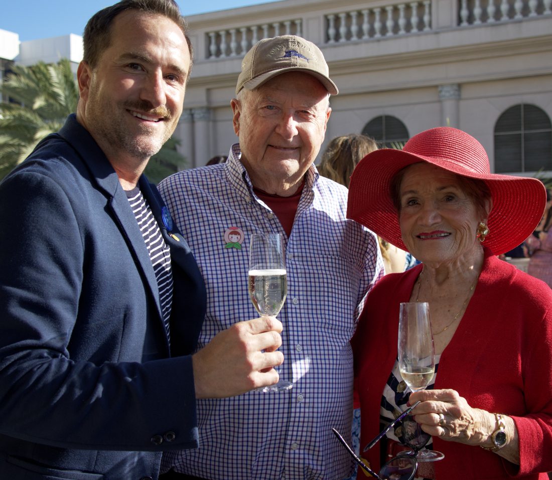 Brian toasting champagne with guests on a Beverly Hills rooftop